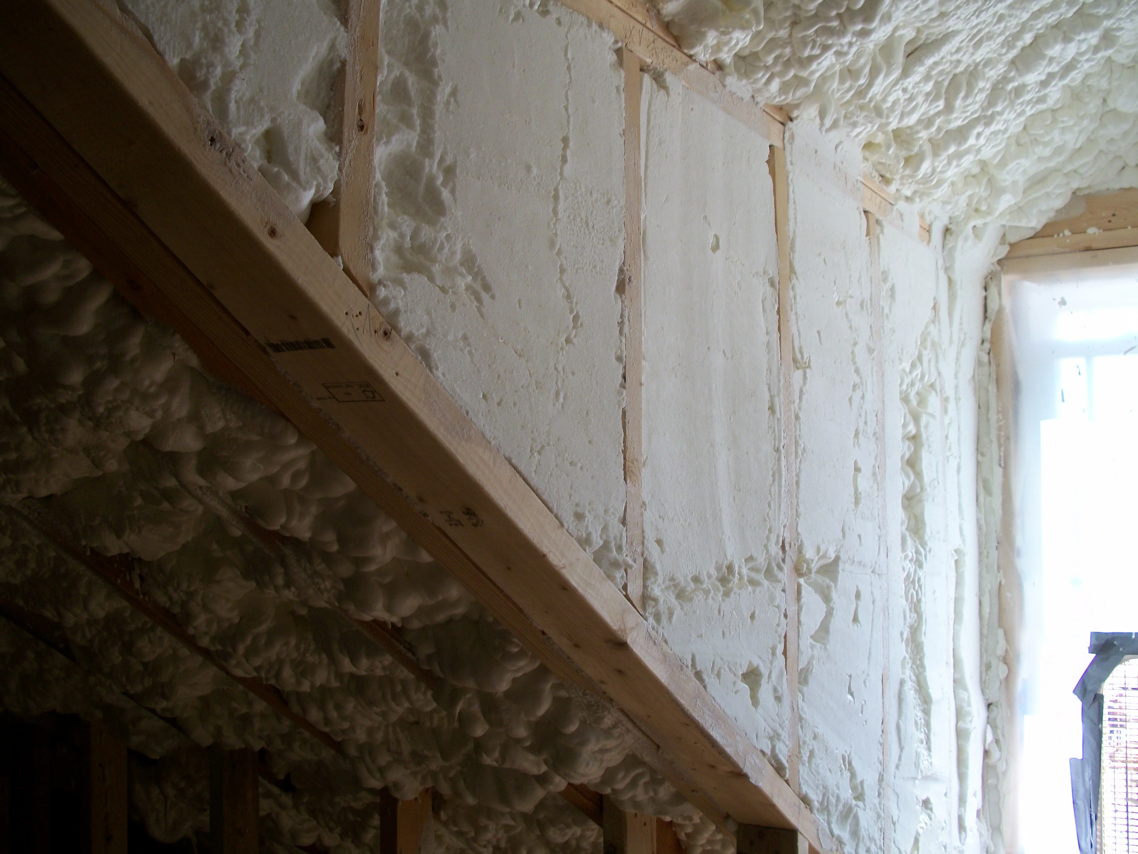 Attic knee wall spray foam insulation