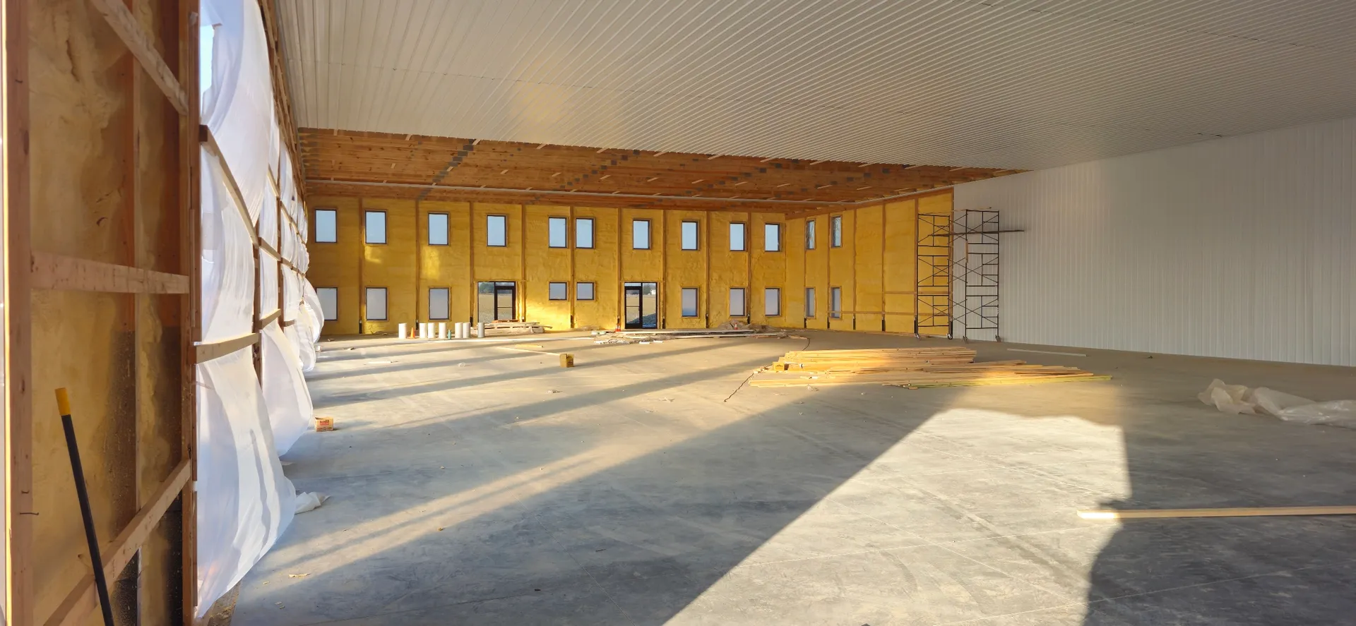 Large commercial building ceiling with spray foam